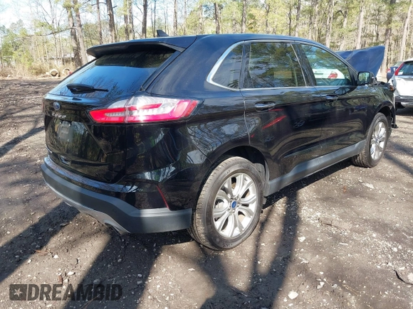 2022 Ford Edge Titanium with VIN 2FMPK4K95NBB06151, listed as a IAAI auction lot 41932545 with 57,762 mi miles and . Bid and sale history available at DreamBid. Image 4.