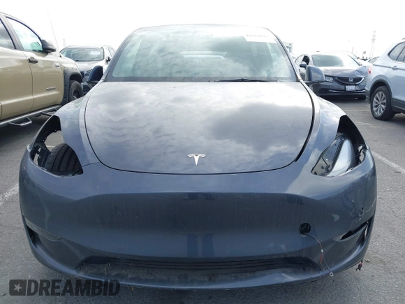 2022 Tesla Model Y Performance with VIN 7SAYGDEF7NF563433, listed as a IAAI auction lot 41713557 with Not Provided miles and . Bid and sale history available at DreamBid. Image 11.