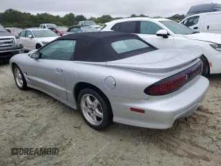 2002 Pontiac Firebird Trans Am z VIN 2G2FV32GX22126136, wystawiony jako Copart lot #74893254 z przebiegiem 7725 mil mil oraz Szkody całkowita. Historia ofert i sprzedaży dostępna na DreamBid. Obrazek 2.