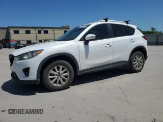 2015 Mazda CX-5 Touring with VIN JM3KE2CY5F0548826, listed as a Copart auction lot 52686565 with 139,602 mi miles and Salvage Title. Bid and sale history available at carsss.com. Image 1.