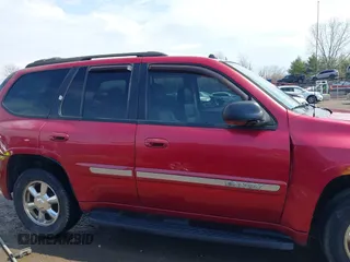 2005 GMC Envoy SLE with VIN 1GKDT13S252127604, listed as a IAAI auction lot 41898390 with 210,655 mi miles. Bid and sale history available at carsss.com. Image 13.