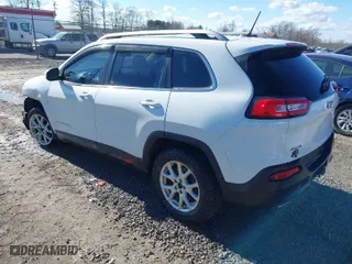 2015 Jeep Cherokee Latitude with VIN 1C4PJMCSXFW588673, listed as a IAAI auction lot 41666268 with 104,737 mi miles. Bid and sale history available at carsss.com. Image 3.