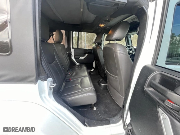 2016 Jeep Wrangler Unlimited 75th Anniversary with VIN 1C4BJWEG5GL215915, listed as a Copart auction lot 52680895 with 143,836 mi miles and Clean Title. Bid and sale history available at carsss.com. Image 6.