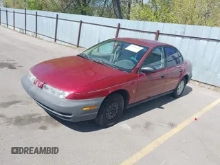 1996 Saturn SL with VIN 1G8ZG5289TZ214790, listed as a IAAI auction lot 42090262 with 197,485 mi miles. Bid and sale history available at carsss.com. Image 2.