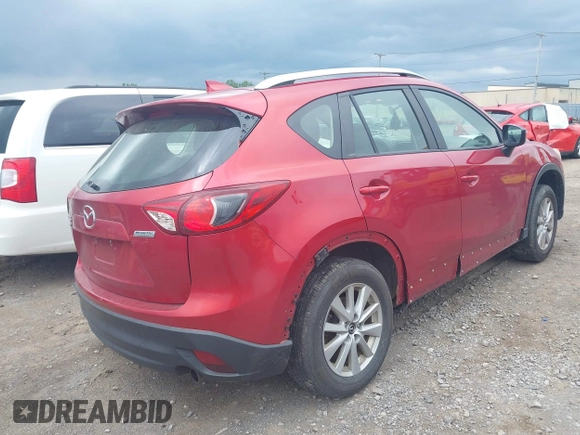 2016 Mazda CX-5 Sport with VIN JM3KE4BY3G0635882, listed as a IAAI auction lot 42545799 with 144,247 mi miles and . Bid and sale history available at DreamBid. Image 4.