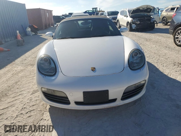 2007 Porsche Boxster S z VIN WP0CB29837U730970, wystawiony jako Copart lot #77829184 z przebiegiem Nie podano mil oraz Szkoda całkowita • Salvage title. Historia ofert i sprzedaży dostępna na DreamBid. Obrazek 5.