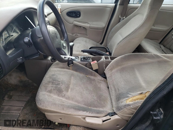 2001 Saturn SL z VIN 1G8ZH52851Z286886, wystawiony jako Copart lot #84883824 z przebiegiem Nie podano mil oraz Szkoda całkowita • Salvage title. Historia ofert i sprzedaży dostępna na DreamBid. Obrazek 7.
