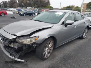 2014 Mazda 6 i Touring with VIN JM1GJ1V60E1141831, listed as a IAAI auction lot 42131200 with 86,597 mi miles and . Bid and sale history available at DreamBid. Image 17.