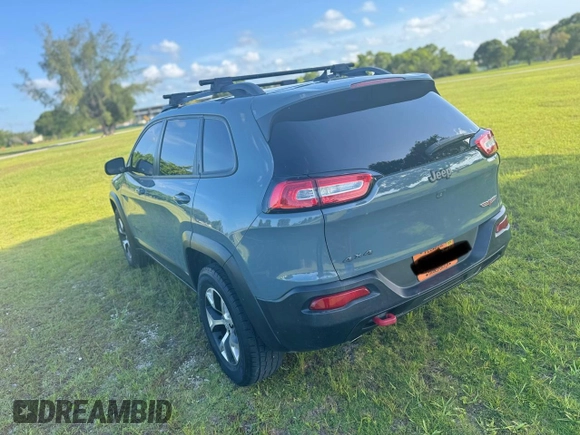 2015 Jeep Cherokee Trailhawk with VIN 1C4PJMBS1FW529559, listed as a Copart auction lot 66581755 with 113,915 mi miles and Salvage title. Bid and sale history available at DreamBid. Image 3.