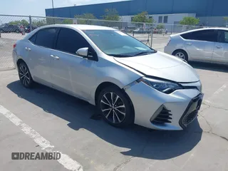 2019 Toyota Corolla L with VIN 5YFBURHE5KP877691, listed as a IAAI auction lot 42108591 with 85,813 mi miles and . Bid and sale history available at DreamBid. Image 1.