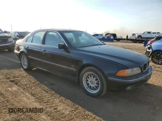 1999 BMW 5 Series 528iA with VIN WBADM634XXGU02243, listed as a Copart auction lot 74981184 with 234,566 mi miles and Salvage Title. Bid and sale history available at carsss.com. Image 4.