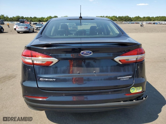 2020 Ford Fusion Plug-In Hybrid Titanium with VIN 3FA6P0SUXLR101997, listed as a Copart auction lot 69575324 with 74,121 mi miles and Salvage Title. Bid and sale history available at carsss.com. Image 6.