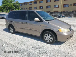2004 Honda Odyssey EX-RES z VIN 5FNRL18814B125773, wystawiony jako Copart lot #58205565 z przebiegiem 250 732 mil mil oraz Szkoda całkowita • Salvage title. Historia ofert i sprzedaży dostępna na DreamBid. Obrazek 4.