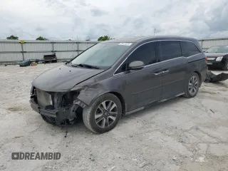 2014 Honda Odyssey Touring with VIN 5FNRL5H90EB059640, listed as a Copart auction lot 59472375 with Not provided miles and Salvage title. Bid and sale history available at DreamBid. Image 1.