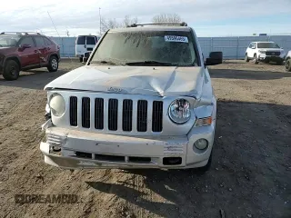 2009 Jeep Patriot with VIN 1J8FF48B49D221606, listed as a Copart auction lot 49596465 with 168,305 mi miles and Salvage title. Bid and sale history available at DreamBid. Image 12.