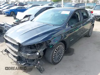 2018 Ford Fusion Titanium with VIN 3FA6P0RU6JR115236, listed as a IAAI auction lot 42111343 with 106,858 mi miles and . Bid and sale history available at DreamBid. Image 18.