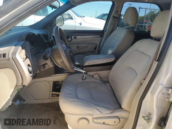 2006 Buick Rendezvous with VIN 3G5DB03L26S521862, listed as a Copart auction lot 82216664 with 157,479 mi miles and Salvage Title. Bid and sale history available at DreamBid. Image 7.