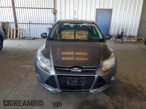 2012 Ford Focus SE with VIN 1FAHP3F28CL114572, listed as a Copart auction lot 63053035 with 142,994 mi miles and Salvage title. Bid and sale history available at DreamBid. Image 5.