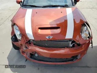 2014 MINI Roadster S z VIN WMWSY3C54ET595156, wystawiony jako Copart lot #68507474 z przebiegiem 43 608 mil mil oraz Tytuł czysty. Historia ofert i sprzedaży dostępna na DreamBid. Obrazek 11.