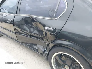 2002 Nissan Maxima GLE z VIN JN1DA31D42T411097, wystawiony jako IAAI lot #41667218 z przebiegiem 213 560 mil mil oraz . Historia ofert i sprzedaży dostępna na DreamBid. Obrazek 6.