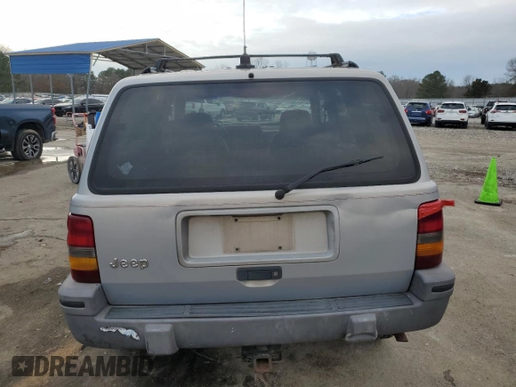 1995 Jeep Grand Cherokee Laredo with VIN 1J4GZ58S7SC517783, listed as a Copart auction lot 43057145 with 225,273 mi miles and Salvage Title. Bid and sale history available at carsss.com. Image 6.