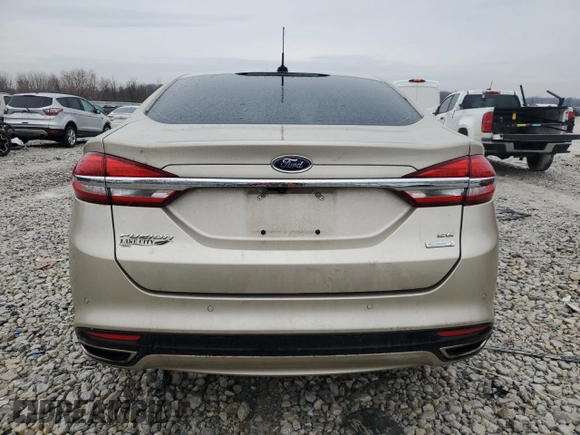 2017 Ford Fusion SE z VIN 3FA6P0H97HR166462, wystawiony jako Copart lot #86265204 z przebiegiem 65 707 mil mil oraz Szkoda całkowita • Salvage title. Historia ofert i sprzedaży dostępna na DreamBid. Obrazek 6.