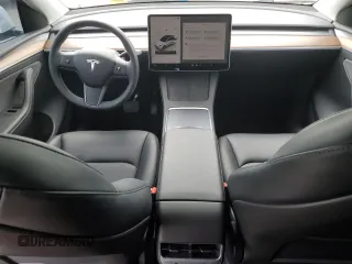 2024 Tesla Model Y Long Range with VIN 7SAYGDEE8RF088808, listed as a Copart auction lot 50406865 with 8,150 mi miles and Salvage title. Bid and sale history available at DreamBid. Image 8.