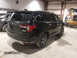 2020 Honda Pilot Touring 7-Passenger with VIN 5FNYF6H63LB032301, listed as a IAAI auction lot 38419333 with 50,433 mi miles and . Bid and sale history available at carsss.com. Image 4.