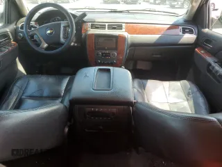 2013 Chevrolet Suburban LT with VIN 1GNSCJE0XDR146798, listed as a Copart auction lot 62408525 with 218,484 mi miles and Salvage title. Bid and sale history available at DreamBid. Image 8.