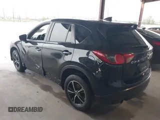 2016 Mazda CX-5 Touring with VIN JM3KE2CY2G0808424, listed as a IAAI auction lot 41880494 with 149,005 mi miles. Bid and sale history available at carsss.com. Image 3.