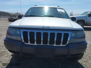 2002 Jeep Grand Cherokee Laredo with VIN 1J4GW48S42C324297, listed as a IAAI auction lot 42050957 with 135,542 mi miles. Bid and sale history available at carsss.com. Image 6.