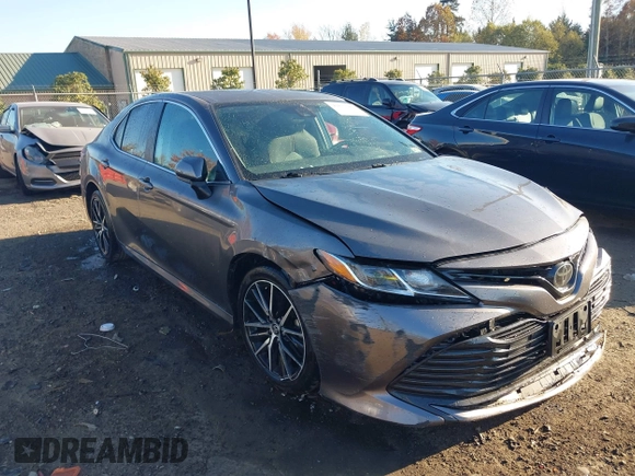 2020 Toyota Camry LE with VIN 4T1C11AKXLU884764, listed as a IAAI auction lot 40821088 with 111,631 mi miles. Bid and sale history available at carsss.com. Image 1.