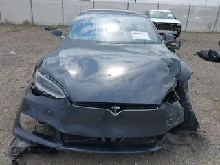 2019 Tesla Model S 75D with VIN 5YJSA1E22KF300407, listed as a IAAI auction lot 40034839 with 59,178 mi miles and . Bid and sale history available at DreamBid. Image 6.