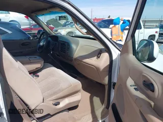 1999 Ford F-150 with VIN 1FTZX1720XKB31945, listed as a IAAI auction lot 42123984 with 187,766 mi miles and . Bid and sale history available at DreamBid. Image 5.