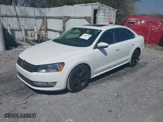 2012 Volkswagen Passat SE w/Sunroof with VIN 1VWBM7A32CC034133, listed as a IAAI auction lot 41889788 with 154,028 mi miles. Bid and sale history available at carsss.com. Image 2.