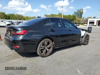 2023 BMW 3 Series 330i with VIN 3MW69FF05P8D21152, listed as a Copart auction lot 48803345 with 21,146 mi miles and Salvage title. Bid and sale history available at DreamBid. Image 3.