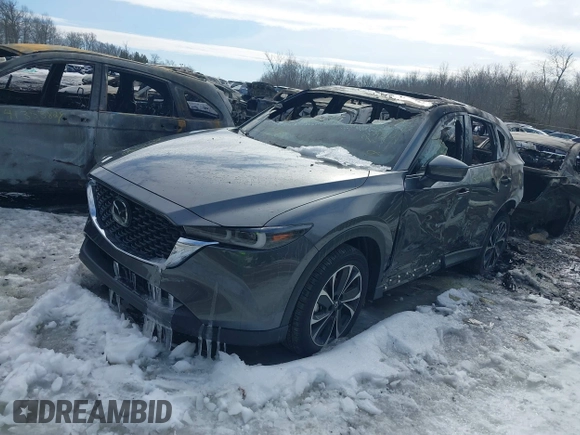 2023 Mazda CX-5 2.5 S Premium Package with VIN JM3KFBDM5P0267412, listed as a IAAI auction lot 40351716 with 7,306 mi miles. Bid and sale history available at carsss.com. Image 2.