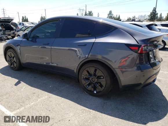 2024 Tesla Model Y Long Range with VIN 7SAYGDEEXRA215975, listed as a Copart auction lot 56705585 with 20,554 mi miles and Salvage Title. Bid and sale history available at DreamBid. Image 2.