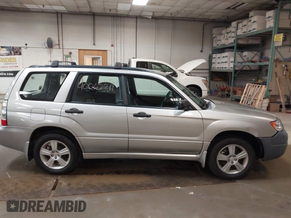 2006 Subaru Forester 2.5 X with VIN JF1SG636X6H712880, listed as a IAAI auction lot 40062211 with 127,537 mi miles. Bid and sale history available at carsss.com. Image 13.