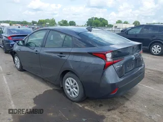 2021 Toyota Prius L Eco z VIN JTDKAMFU3M3152785, wystawiony jako IAAI lot #42501351 z przebiegiem 60 489 mil mil oraz . Historia ofert i sprzedaży dostępna na DreamBid. Obrazek 3.