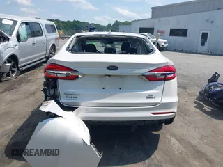 2020 Ford Fusion SE z VIN 3FA6P0LU5LR153942, wystawiony jako IAAI lot #42145638 z przebiegiem 99 961 mil mil oraz . Historia ofert i sprzedaży dostępna na DreamBid. Obrazek 16.