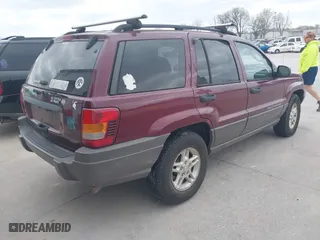 2003 Jeep Grand Cherokee Laredo with VIN 1J4GW48S83C563627, listed as a IAAI auction lot 41910225 with 150,264 mi miles. Bid and sale history available at carsss.com. Image 4.