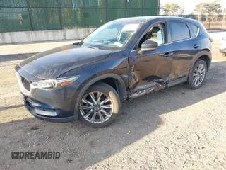 2020 Mazda CX-5 Grand Touring with VIN JM3KFBDM4L0779284, listed as a IAAI auction lot 42060936 with 9,227 mi miles. Bid and sale history available at carsss.com. Image 18.