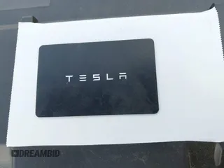 2023 Tesla Model 3 with VIN 5YJ3E1EA2PF623217, listed as a IAAI auction lot 41701413 with 21,246 mi miles and . Bid and sale history available at DreamBid. Image 11.
