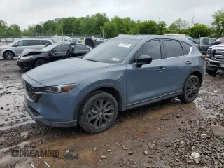 2023 Mazda CX-5 S Carbon Edition z VIN JM3KFBCM5P0241071, wystawiony jako Copart lot #57767375 z przebiegiem 21 611 mil mil oraz Szkoda całkowita • Salvage title. Historia ofert i sprzedaży dostępna na DreamBid. Obrazek 1.