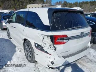 2023 Honda Odyssey Touring with VIN 5FNRL6H81PB008129, listed as a IAAI auction lot 41610714 with 57,273 mi miles and . Bid and sale history available at DreamBid. Image 3.