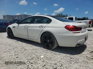 2014 BMW M6 with VIN WBS6C9C55ED467226, listed as a Copart auction lot 61779015 with Not provided miles and Salvage title. Bid and sale history available at DreamBid. Image 2.