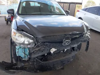 2014 Mazda CX-5 Touring with VIN JM3KE2CY9E0384401, listed as a IAAI auction lot 41699913 with 75,301 mi miles. Bid and sale history available at carsss.com. Image 6.