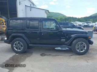 2021 Jeep Wrangler Unlimited Sahara with VIN 1C4HJXEN4MW610287, listed as a IAAI auction lot 42538525 with 24,861 mi miles and . Bid and sale history available at DreamBid. Image 14.
