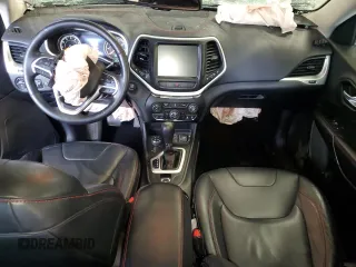 2014 Jeep Cherokee Trailhawk with VIN 1C4PJMBSXEW213981, listed as a Copart auction lot 60440495 with 136,612 mi miles and Salvage title. Bid and sale history available at DreamBid. Image 8.